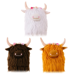 Three Highland Cow plush toys in white, brown, and ginger with floral crowns and soft fur
