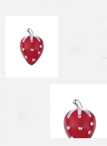 Macro detail of S925 sterling silver strawberry stud earring with red enamel finish