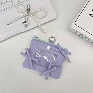 Macro view of lavender bow card holder with transparent window and zipper detail
