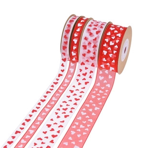 Detailed view of heart pattern ribbons in red and white for romantic gift wrapping