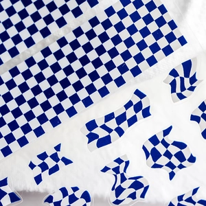 Blue and white checkerboard 5D relief nail stickers with fluid patterns on white plush