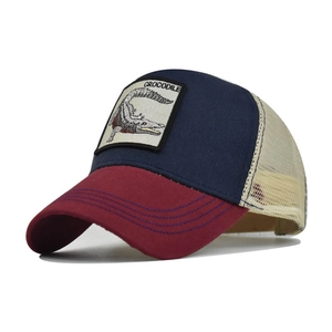 Detailed side view of navy and red cotton trucker hat with crocodile animal patch