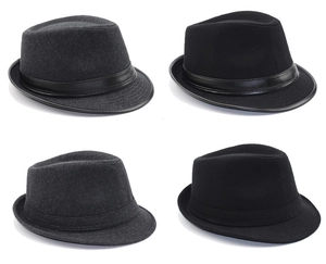 Close-up of wool felt fedora hats in black and grey with leather bands and premium texture