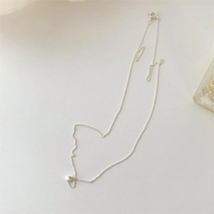 Detailed view of fine 925 sterling silver chain with a minimalist heart-shaped pendant