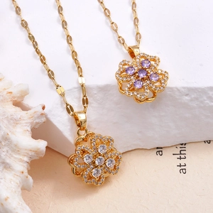 Golden titanium steel necklaces with spinning clover pendants and zircon stones
