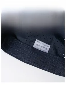 Detail of moisture-wicking sweatband and breathable mesh lining on navy polyester sports cap