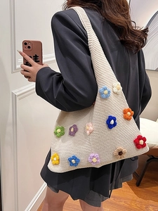 Chic knit shoulder bag in beige featuring colorful crochet flower appliqués for women