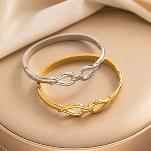 Minimalist knot design stainless steel bracelets in gold and silver finishes