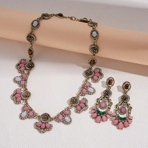 Vintage bronze necklace and earrings set with pink crystals and floral geometry