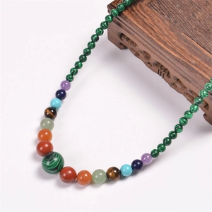 Detail of colorful beads with central malachite on bohemian stone yoga necklace
