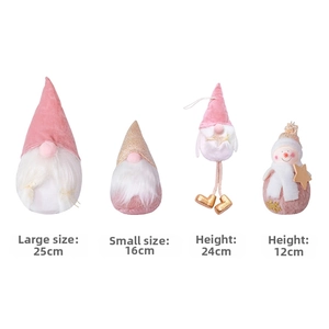 Pink velvet Christmas gnomes and snowman figurines showing various heights and soft textures