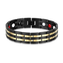 Macro detail of men's health magnetic therapy bracelet with dual-tone black and gold links