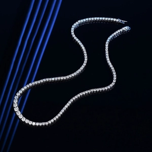 Luxurious silver gradient tennis necklace with sparkling round cut zircons on black background