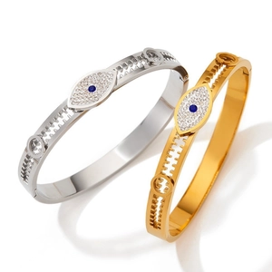 Elegant stainless steel evil eye bangle with sparkling crystal inlay in gold and silver