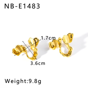 Detail showing irregular gold wavy earrings with dimensions 3.6cm by 1.7cm and 9.8g weight