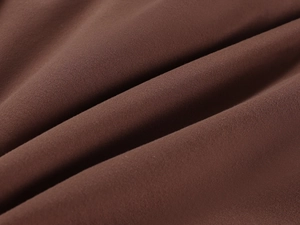 Macro shot of dark brown high-elastic fabric showing smooth skin-friendly texture and ribs