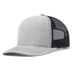 Detail of grey trucker hat with breathable black mesh back and curved brim for sun protection