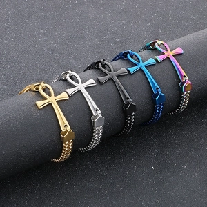 Detail of Ankh cross bracelets in five colors on a textured column display