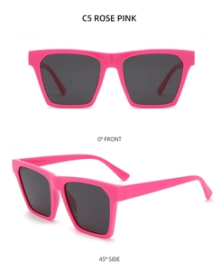 Detail view of rose pink square sunglasses with wide temples and dark grey lenses