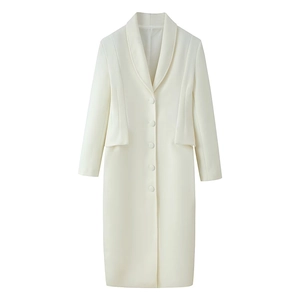 Detail of cream white wool coat featuring notch lapels and five-button single-breasted closure