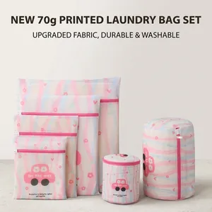 Detailed close-up of mesh laundry bags with pink floral and wave printed patterns