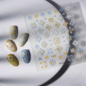Detail view of 5D embossed nail stickers FEB-633 with blue and gold floral patterns