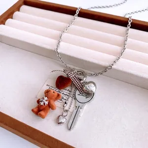Titanium steel chain necklace with flocked bear, red heart, and plaid bow pendants