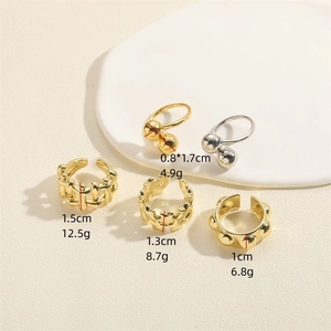 Polished metal open rings set featuring woven star and rivet designs in gold and silver