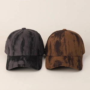 Detail of vintage tie-dye distressed baseball caps with heavy washed texture and ink patterns