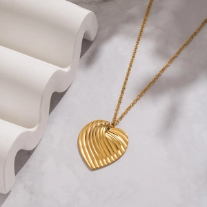 Elegant gold heart necklace with textured wavy finish for minimalist daily fashion wear