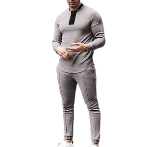 Men's grey waffle knit two-piece tracksuit featuring zip-up long sleeve top and slim pants