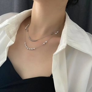Double-layered titanium steel necklace with elegant white pearls and silver metal beads