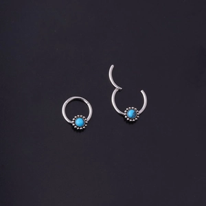 Pair of silver stainless steel hinged rings with blue turquoise stones and beaded trim