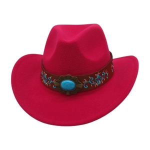 Detail of pink felt cowboy hat featuring floral embroidery and turquoise stone ornament