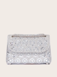 Detailed view of silver evening bag featuring sunflower crystal patterns and metal chain