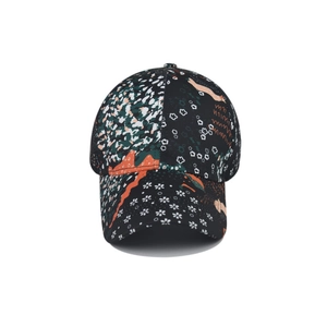 Tie-dye baseball cap featuring colorful floral patterns on a deep black cotton fabric