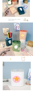 Close-up of pastel desktop pen holders with 3D cartoon icons and dual-compartment design