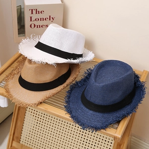 Straw fedora hats with frayed edges and black ribbons in white, khaki and navy blue