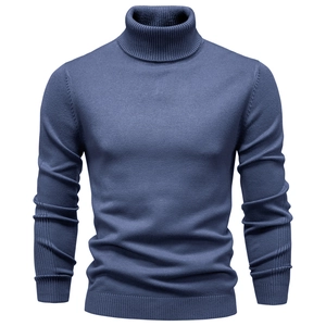 Close-up of the ribbed turtleneck and soft knit texture on the blue men's sweater