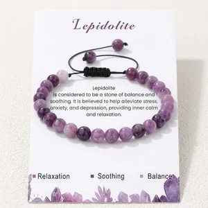Detail of purple Lepidolite beaded bracelet on a relaxation and balance card