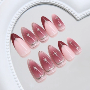 Almond press on nails with red gradient, silver star patterns and french outlines
