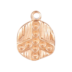 Close-up of golden irregular stainless steel pendant with cross embossed pattern