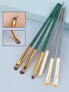 Detailed view of dual-color fiber eye brushes with flat angled heads for eyeliner and brow