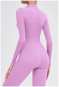Rear view of a pink long sleeve thermal yoga jumpsuit showing slim fit and back silhouette