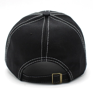 Detail of black cotton baseball cap with white contrast stitching and adjustable metal buckle
