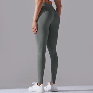 Detail of high-waist seamless yoga pants with vertical texture and peach butt lift effect