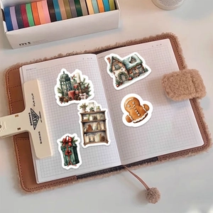 8 sheets of Christmas stickers with cabins and gingerbread man for DIY planners