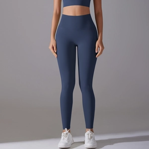 Close-up of high-waist seamless navy blue yoga leggings showing elastic tummy control fit