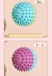 Detail of hollow TPR dog balls with footprint patterns and dental massage spikes