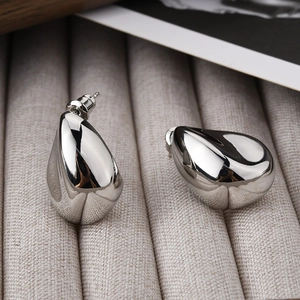 Polished silver teardrop earrings with a sleek minimalist metal design for women